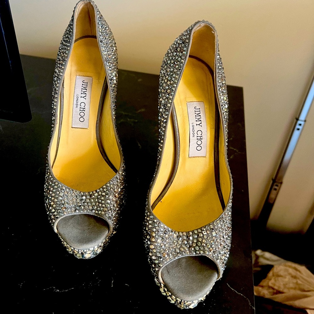 Jimmy Choo pumps only wore 1 1/2 times in perfect condition with out the box!